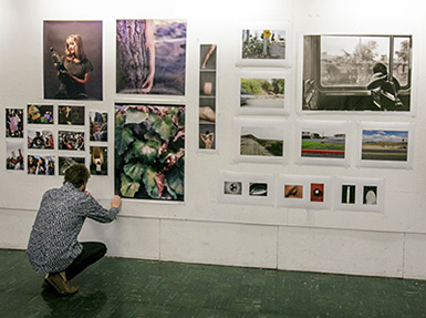 A Roski student at an art exhibit